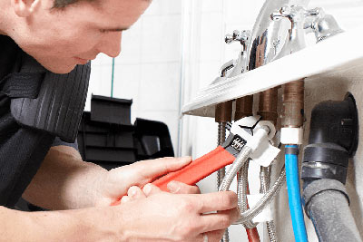 Ken is repairing a bathtub